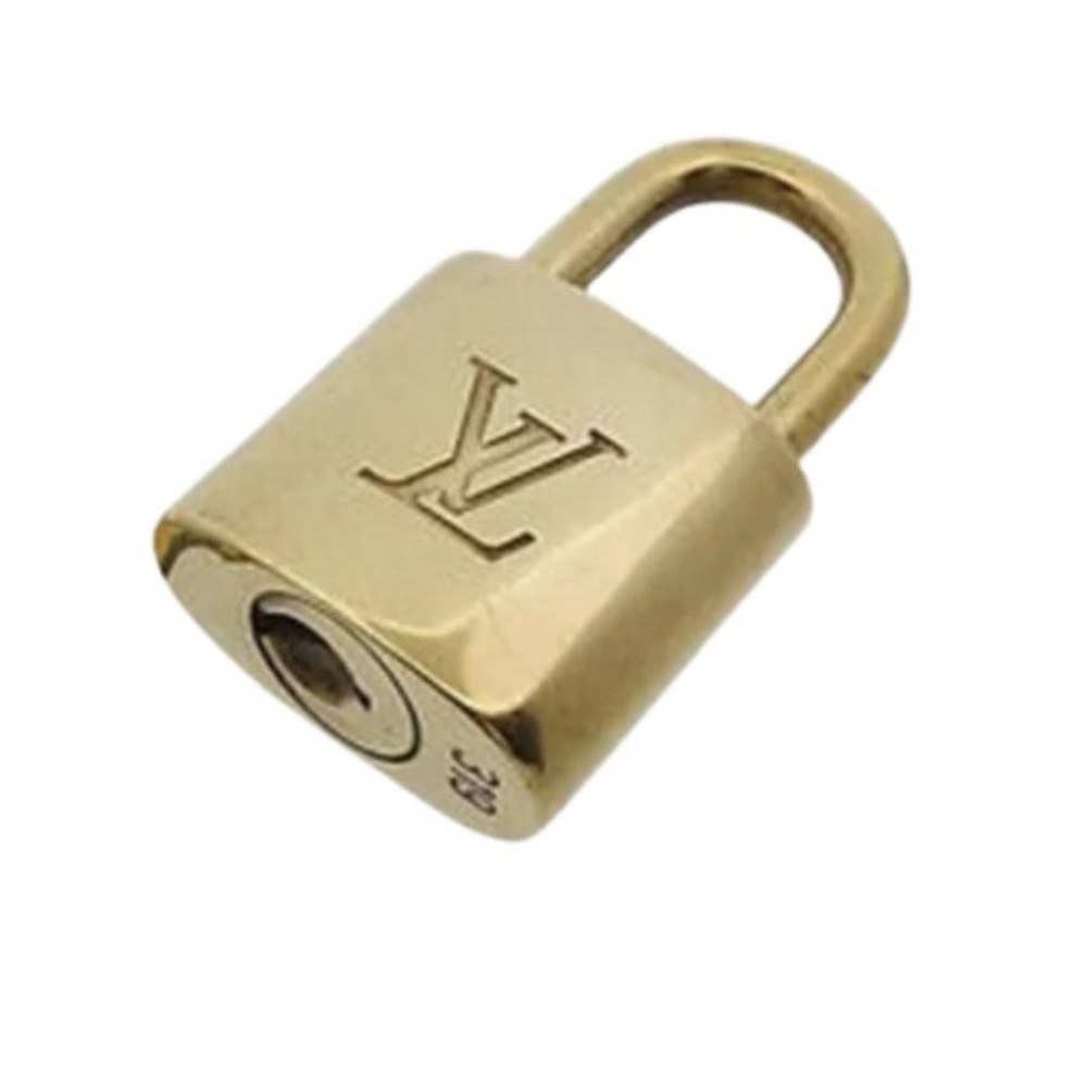 Authentic Louis Vuitton lock # 310.  Comes with 17” Rose gold chain. No key